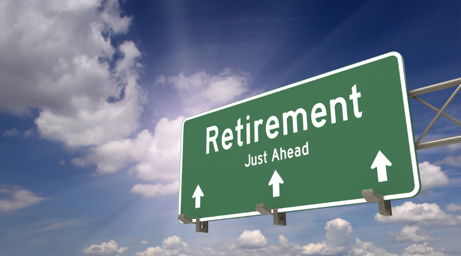 Image of a road sign pointing to retirement. Saving for retirement, retirement savings